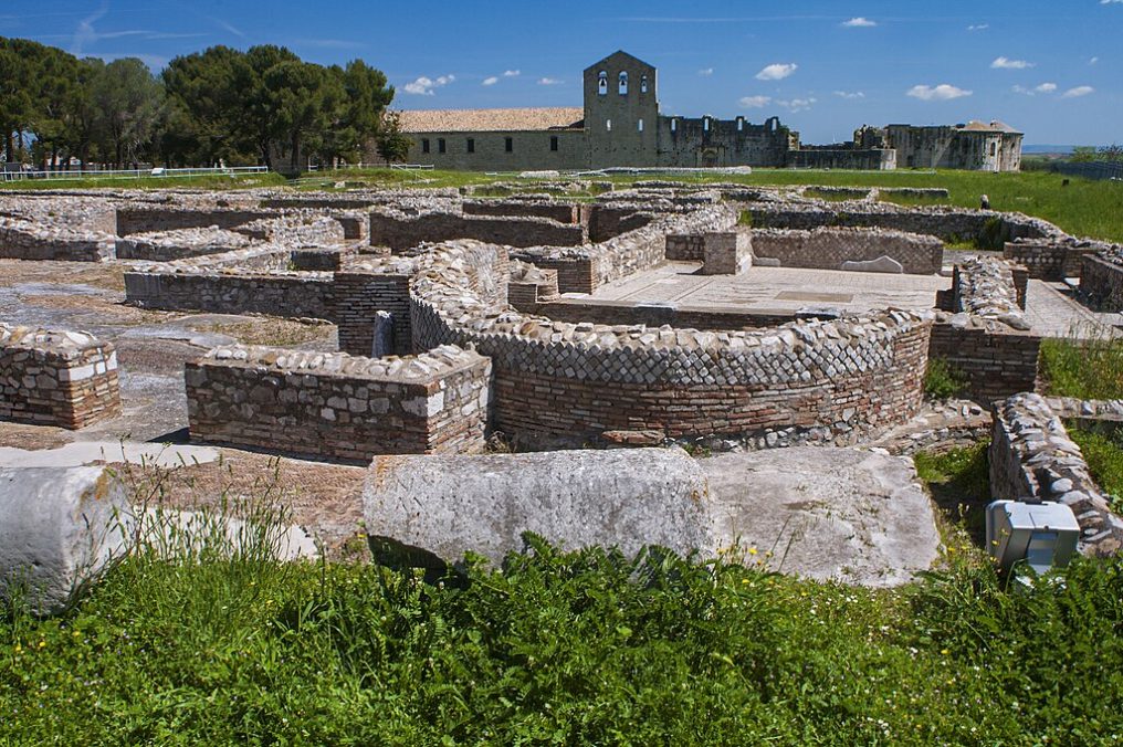 Venosa, Venusia Archaeological Park in foreground. Incompiuto (Unfinished Cathedral) in background.